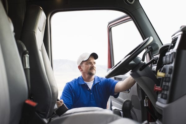 man getting into commercial truck, commercial trucking insurance